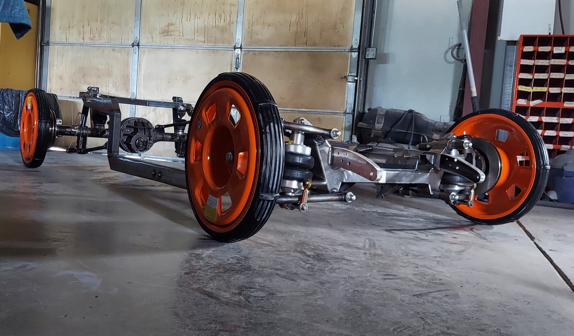 Custom chassis fabrication and modification work showing precision metalwork and structural enhancements